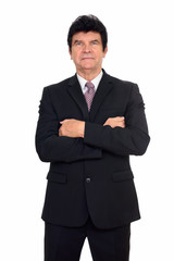 Portrait of mature handsome businessman in suit with arms crossed
