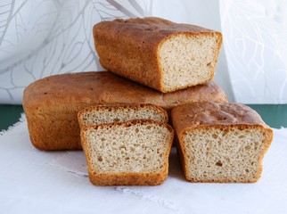 loaf and slices of tasty homemade bread