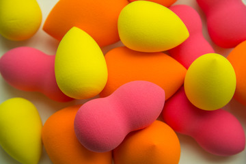 bright beauty blenders on a white background