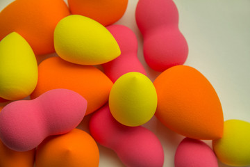 bright beauty blenders on a white background