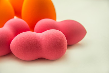 bright beauty blenders on a white background