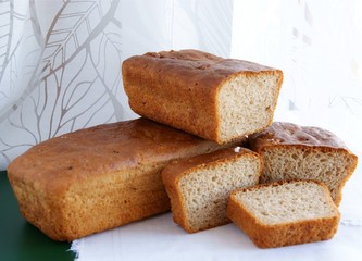 loaf and slices of tasty homemade bread