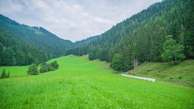 fabulous forest, mountain and Topla Valley in Crna na Koroskem, panning right.