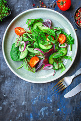 Healthy salad, leaves mix salad (mix micro greens, cucumber, tomato, onion, other ingredients). food background. copy space for text