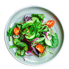 Healthy salad, leaves mix salad (mix micro greens, cucumber, tomato, onion, other ingredients). food background. copy space for text