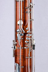 Wooden bassoon isolated on a white background. Music instruments.