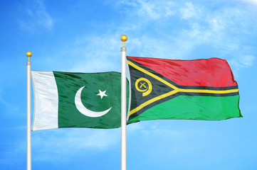 Pakistan and Vanuatu two flags on flagpoles and blue cloudy sky