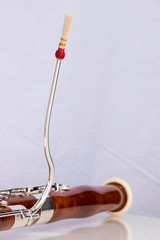 Wooden bassoon isolated on a white background. Music instruments.