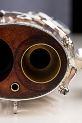 A part of a wooden bassoon. Music instruments.