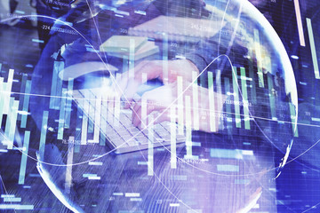 Double exposure of businessman working on laptop on background. International business hologram in front. Concept of success.