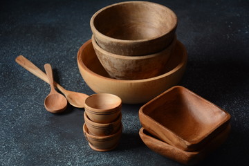 Culinary background emty ceramic plates, wooden or bamboo spoons and bowls. Rustic style. Home Kitchen Decor