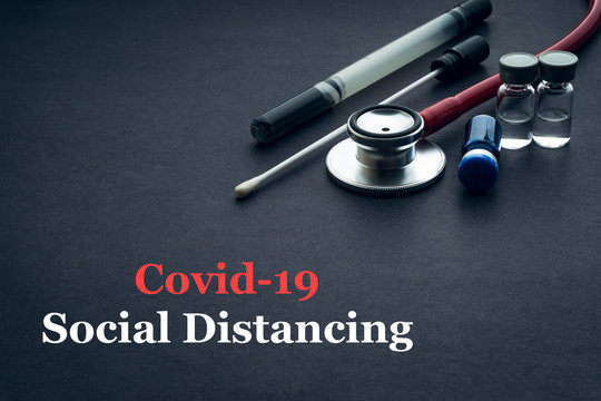 COVID-19 or CORONAVIRUS SOCIAL DISTANCING text with stethoscope, medical swab and vial on black background. Covid-19 or Coronavirus concept. - Powered by Adobe