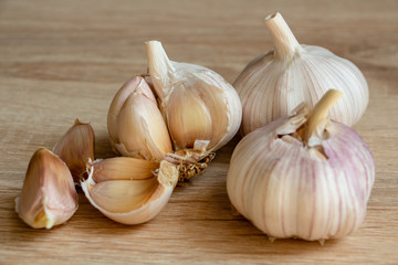 winter garlic close-up on a wooden background