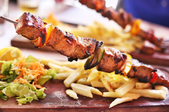 traditional greek souvlaki with chicken and potatoes - greek kontosouvli - greek cuisine