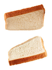 Slices of toast flying isolated on white