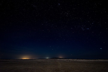 Gorgeous night image with brilliant stars in the middle of the desert in Masirah island, Oman