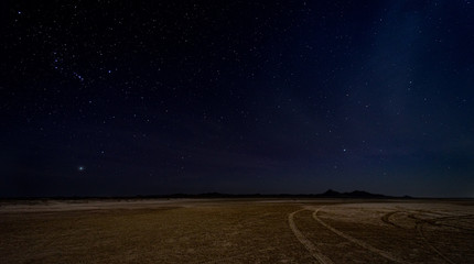 Gorgeous night image with brilliant stars in the middle of the desert in Masirah island, Oman