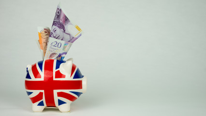 united kingdom flag on piggy bank uk currency