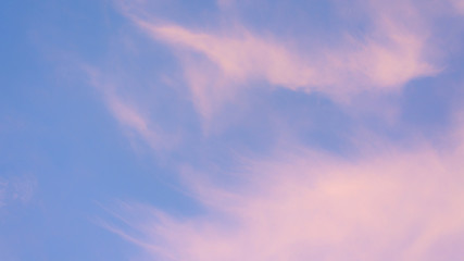 pink pastel clouds at sunset blue sky. abstract photo, background image.
