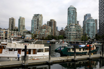Fototapeta na wymiar Vancouver, America - August 18, 2019: False Creek Bay alongside the Granville street bridge, Vancouver, America