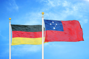 Germany and Samoa two flags on flagpoles and blue cloudy sky