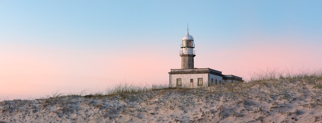 Lighthouse behind the dune