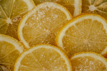 juicy slices of lemon sprinkled with sugar close-up