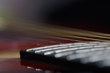 Fototapeta premium Abstract background in strings of an acoustic guitar macro