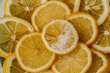 juicy slices of lemon sprinkled with sugar close-up
