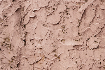 Clay strokes on the wall. Backgound texture concept. Photo of rough strokes of brown beige paint . Wallpaper and copy space