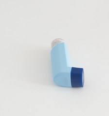 Asthma inhaler isolated on white background