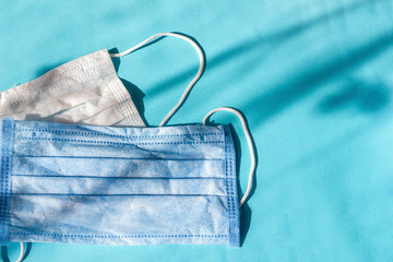 Two medical mask in blue and white to protect against flu and other diseases. Surgical face shield....