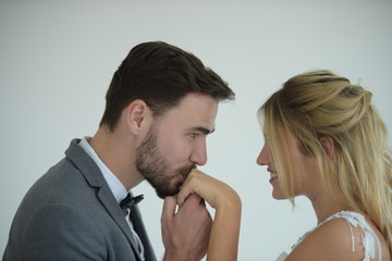 The image of the couple, the groom and the bride kissing happily.