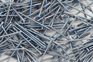 Iron nails. Construction nails on the boards. Background. 