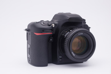 Fototapeta premium black SLR camera on a white background