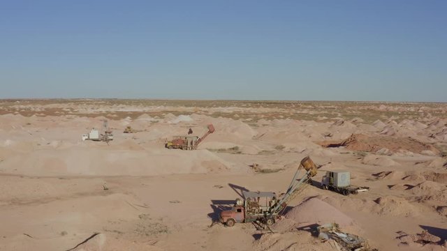 Surreal Outback Australian Opal Fields of Coober Pedy. Vast Mars Like landscape of diggings and mine shafts. Some showing aged machinery from yesteryear.