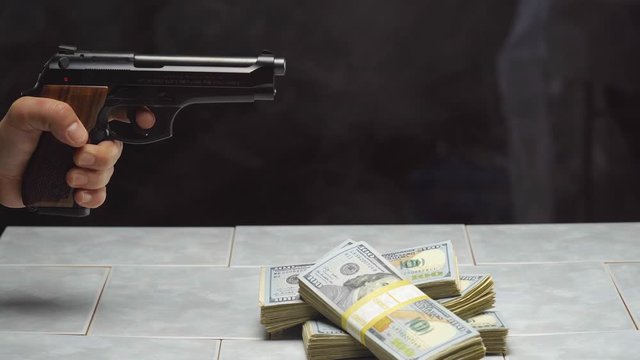 Gun Owner Wins Out Over Knife for Pile of Money