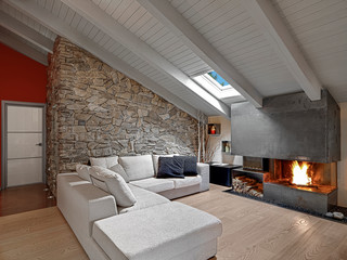 interiors of modern living room with fireplace in the attic