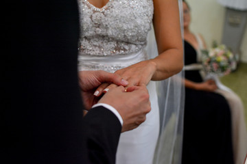 Obraz na płótnie Canvas bride and groom with their rings