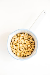 Raw Cashews in White Enamel Pot
