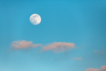 Naklejka na ściany i meble Full moon and some clouds at dawn.