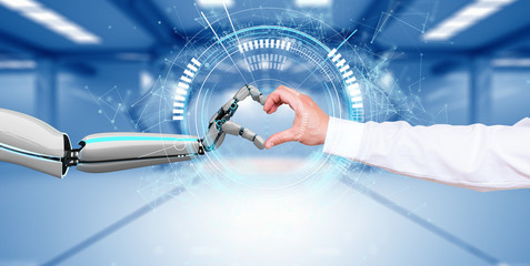 Robot and human form a heart with their hands.