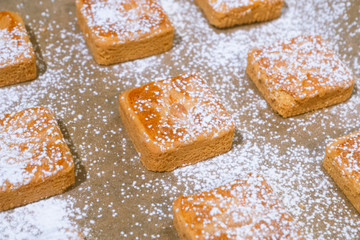 Confectionery - still life. Cookies, bakery products, tangerines, eggs. Cooking dessert and sweets. Sugar and cafe. Coffee or tea to buns. Still life with food