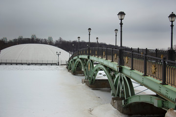 Bridge on white snow in the forest