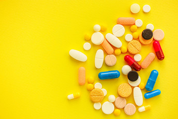 pills, different pills and drugs to treat and increase immunity, medical preparations. background top view. copy space for text