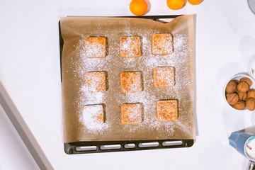 Confectionery - still life. Cookies, bakery products, tangerines, eggs. Cooking dessert and sweets. Sugar and cafe. Coffee or tea to buns. Still life with food