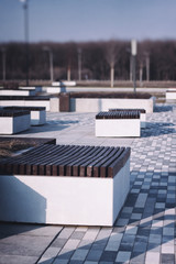 empty benches of a city park due to quarantine