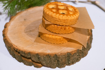 Confectionery - still life. Cookies, bakery products, tangerines, eggs. Cooking dessert and sweets. Sugar and cafe. Coffee or tea to buns. Still life with food