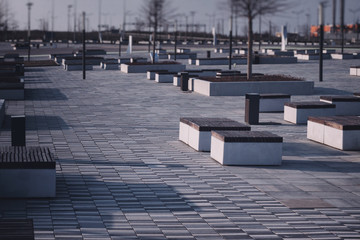 Fototapeta premium empty benches of a city park due to quarantine