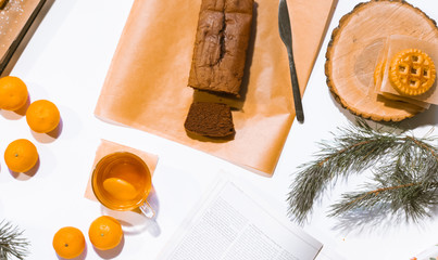 Confectionery - still life. Cookies, bakery products, tangerines, eggs. Cooking dessert and sweets. Sugar and cafe. Coffee or tea to buns. Still life with food